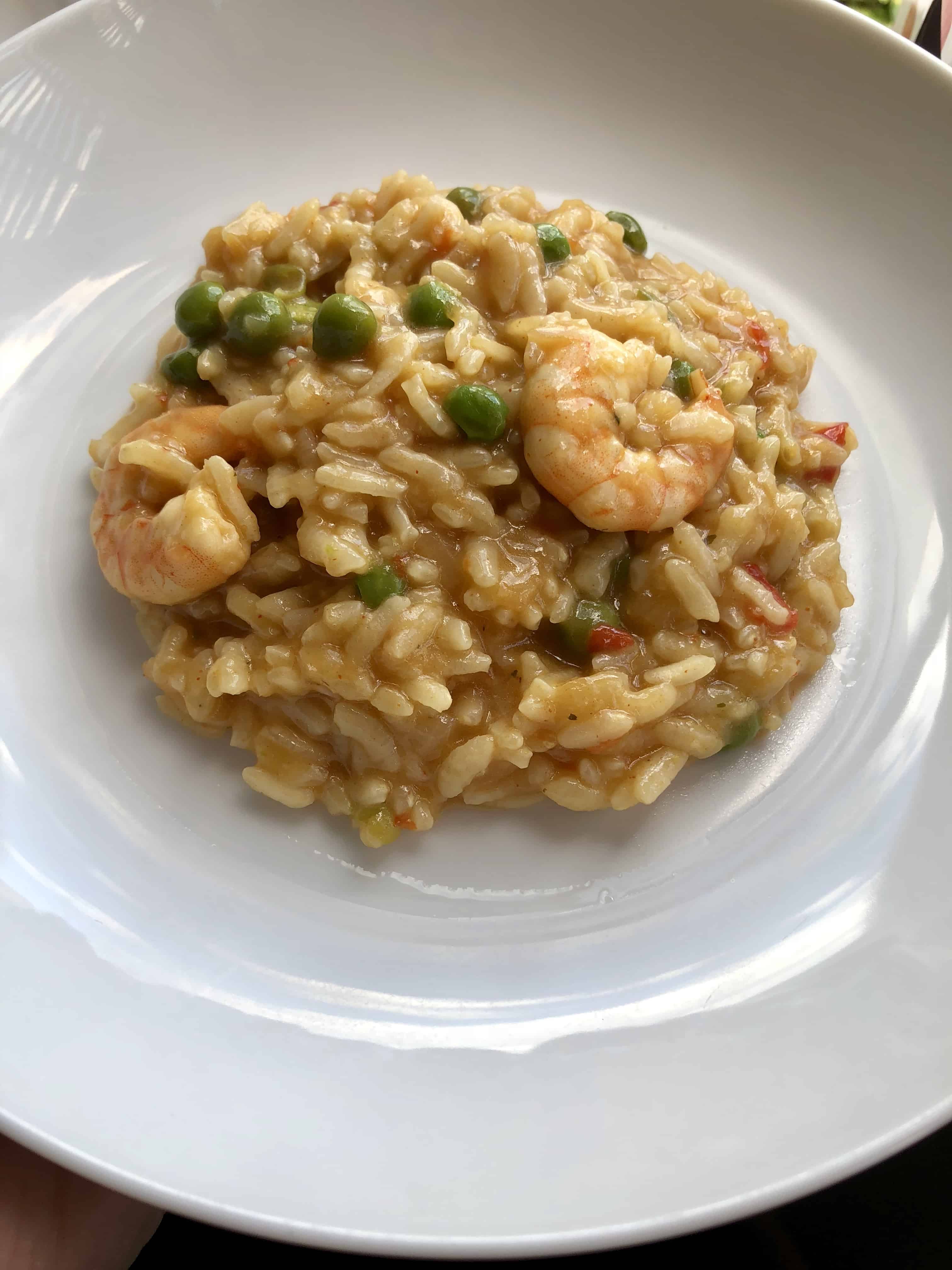 Instant Pot Prawn Trout and Pea Risotto looking served on a white plate