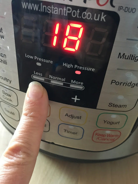 Photo of the Instant Pot Duo's control panel, an index finger is programming 18 minutes