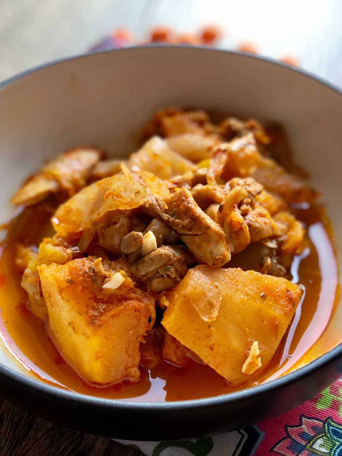 Photo of the chicken and butternut squash served in a bowl, seen close up