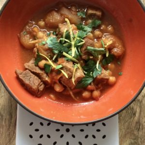 Instant Pot Lamb Tagine recipe by Feisty Tapas - here served in an orange bowl