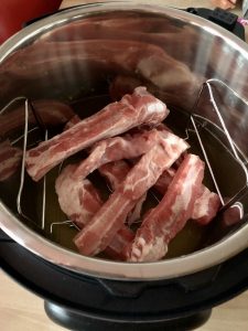 Pork ribs ready to pressure cook on the Instant Pot Duo Crisp trivet
