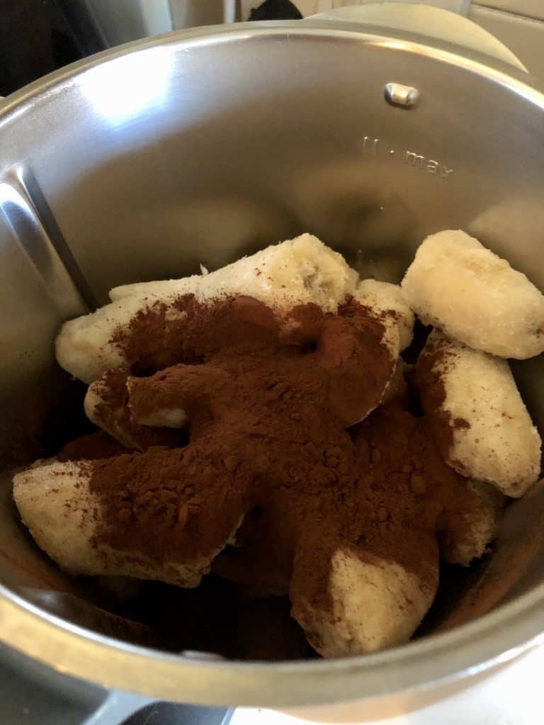 Step 1 - Frozen banana and cocoa powder in the Thermomix bowl ready to blend