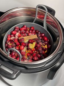 How to pressure cook Cranberry Sauce (with Instant Pot instructions) - all ingredients in the Instant Pot silicone steamer set cake pan and trivet steamer rack