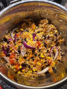 Pressure cooked Mexican Rice after mixing with red onion