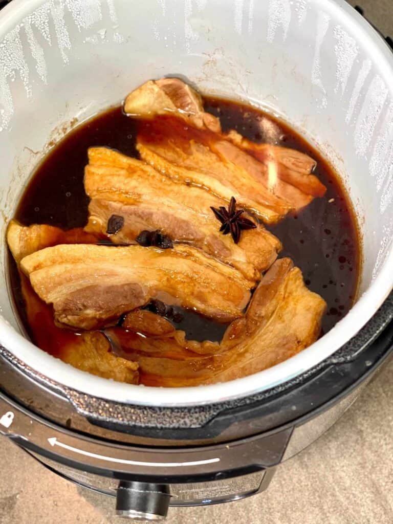 Pressure Cooker Oriental Pork Belly right after opening the lid after pressure cooking - show in the inner pot of the Ninja Foodi Max multicooker