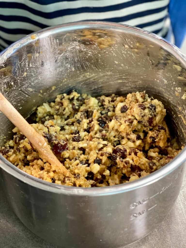 all the ingredients of a Christmas pudding seen mixed and ready to transfer to pudding basins