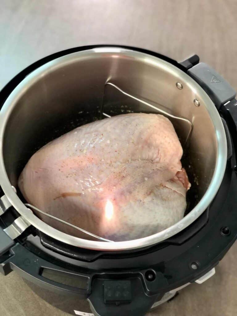 Turkey Crown on trivet inside Instant Pot Pro Crisp inner pot, seen from above