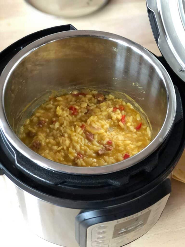 Chorizo risotto after a quick pressure release, seen from above inside the inner pot of the Instant Pot Duo Mini