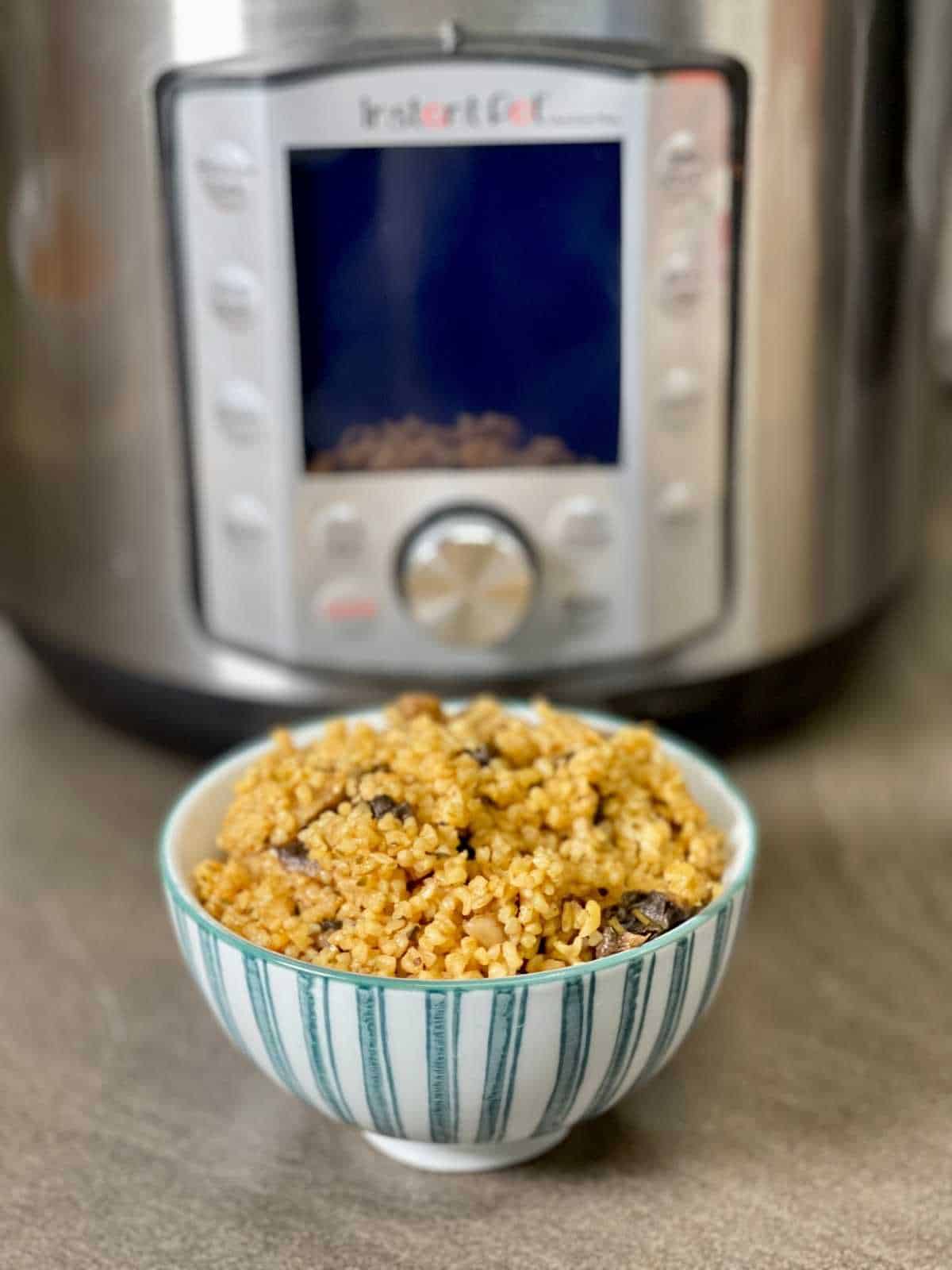 Pressure cooked mushroom bulgar whear with Instant Pot Duo Evo Plus in the background
