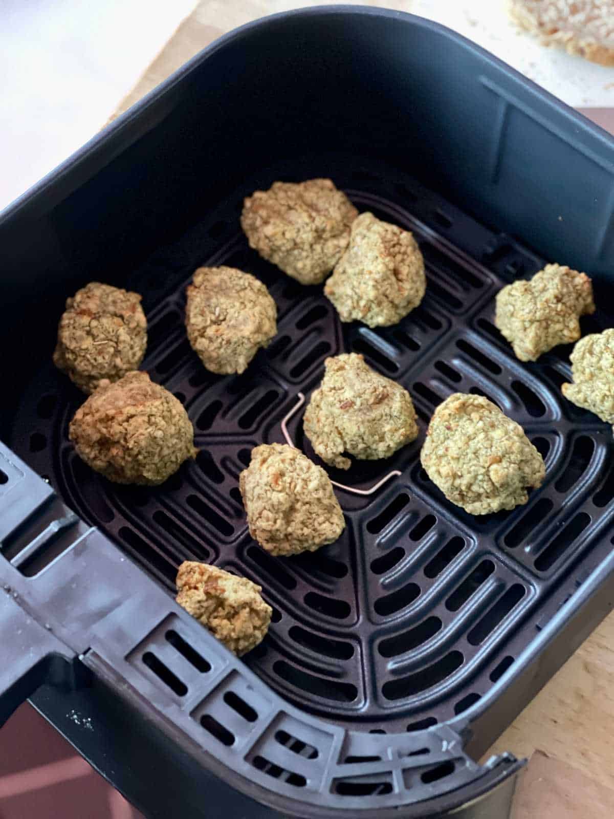 Photo of Balls of Paxo Sage and Onion Stuffing in the basket of the Instant Vortex Air fryer