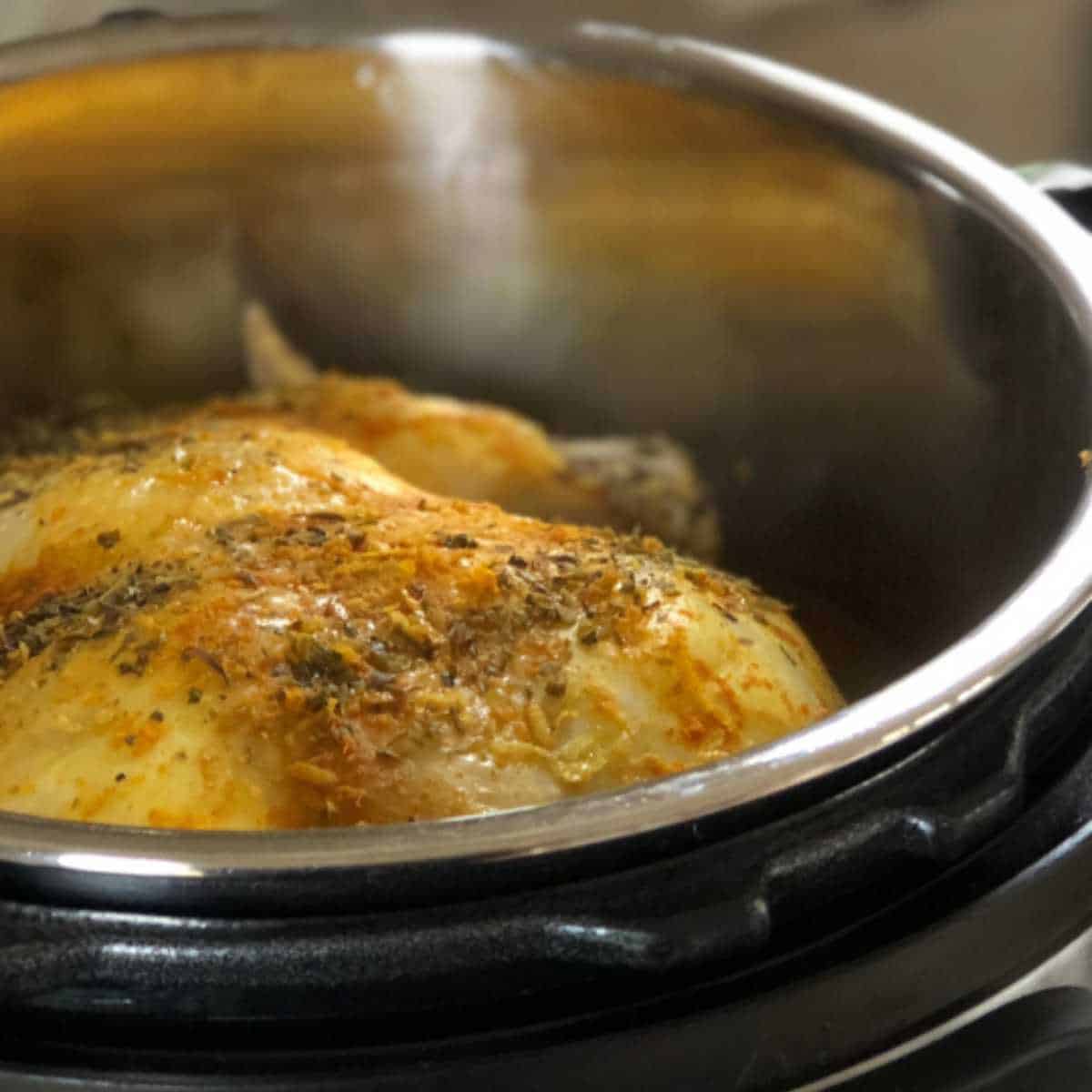 Photo of the lemony whole chicken seen inside the Instant Pot
