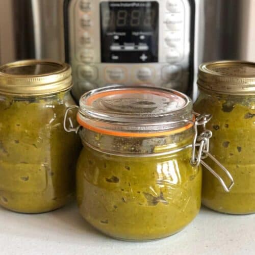 Photo of three kilner jars filled with vegetable stock paste with an Instant Pot electric pressure cooker in the background