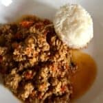Photo of the mince since with a nice round block of the cooked rice on a white plate, get ready to dig in