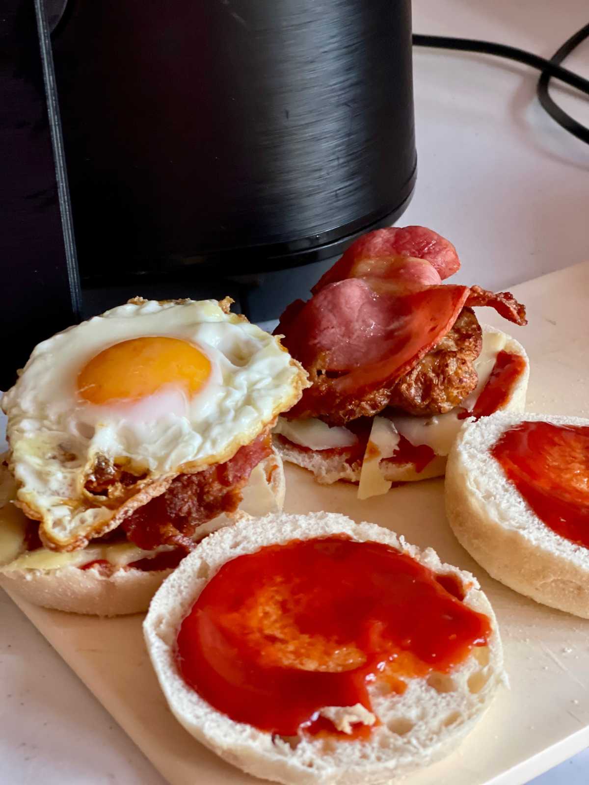 Photo showing the egg sausage and bacon muffins being assembled with ketchup