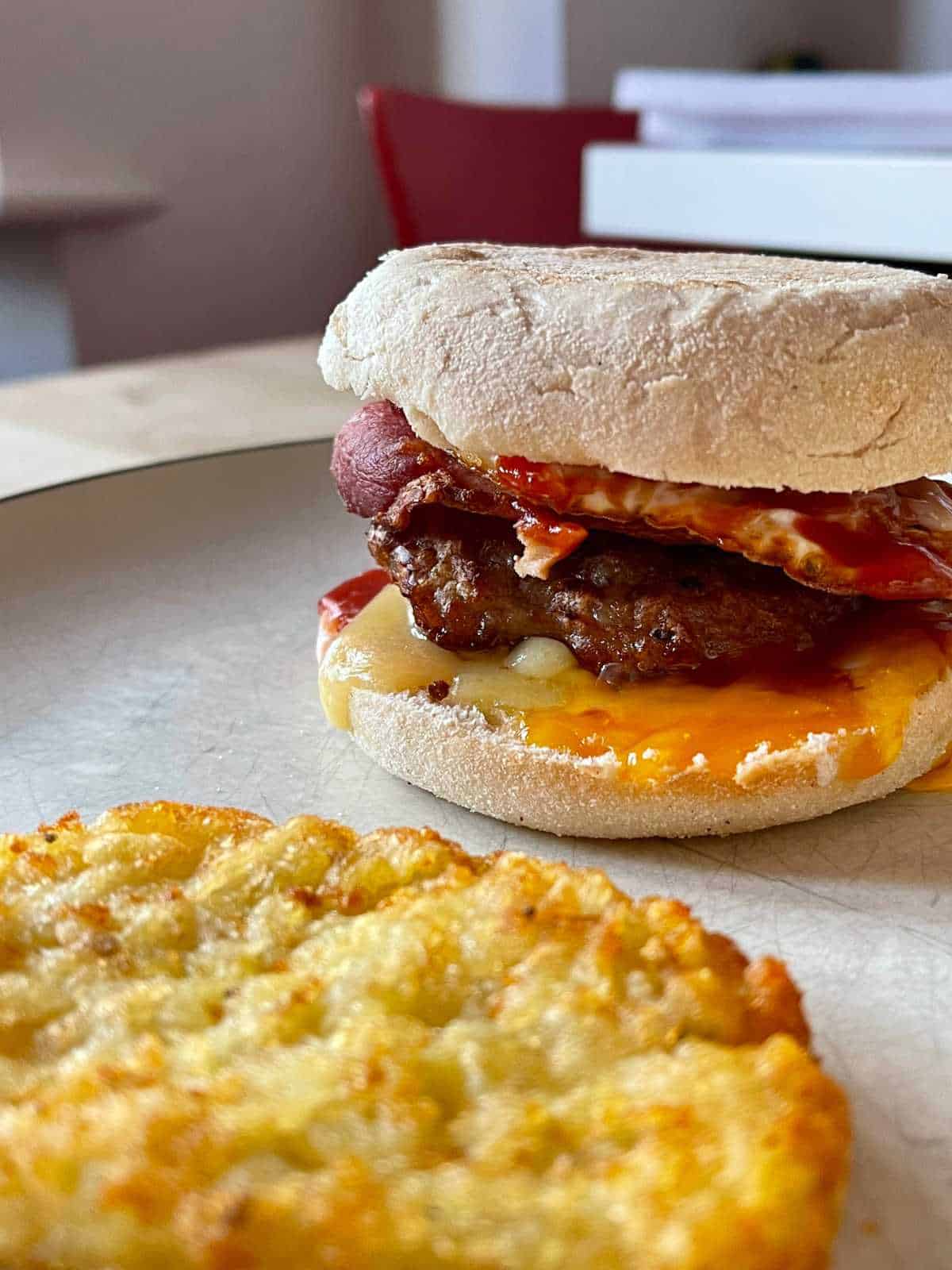 Photo of a delicious air fryer mcmuffin with a lovely golden hash brown at the front