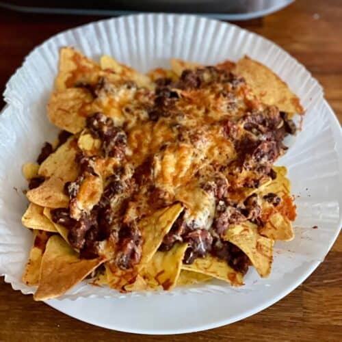 Photo from above of Nachos air fried in the Ninja Speedi on a liner using a quick bean chilli made in the Thermomix