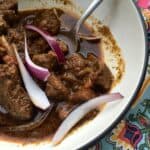 Photo of the delicious Instant Pot Beef with Mexican Spices, tender beef and delicious sauce with a few wedges of red onion