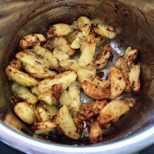 Photo of the Instant Pot Greek Roast Potatoes inside the stainless steel inner pot