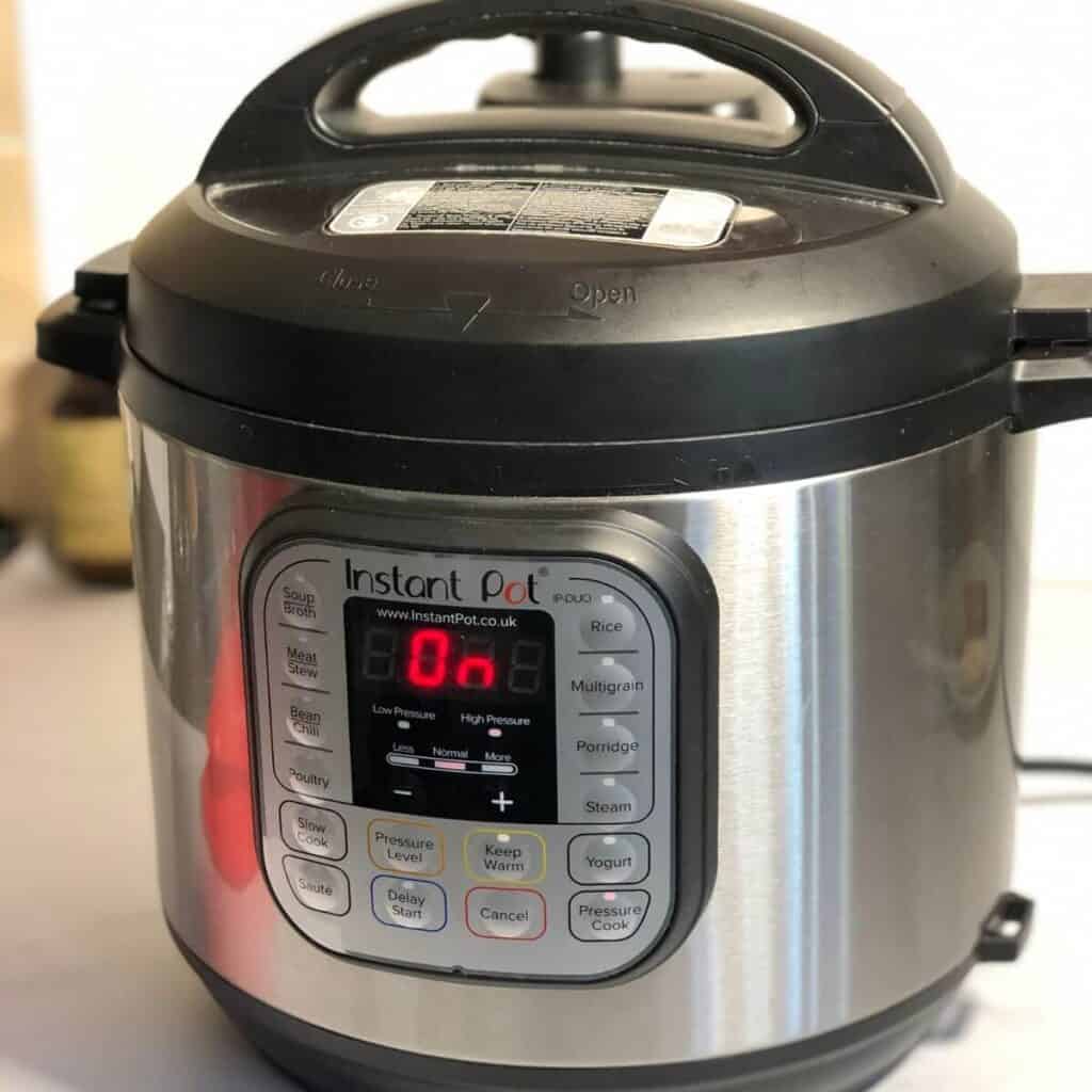 Photo of an Instant Pot Duo Mini, the display says 'On'