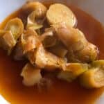 Photo of the leeks and potatoes surrounded by wonderful broth tinged with the colour of paprika