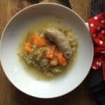 Photo of the sausage and apple casserole served on a white plate, should you need a good giggle it might be handy to know that the sausage looks rather phallic