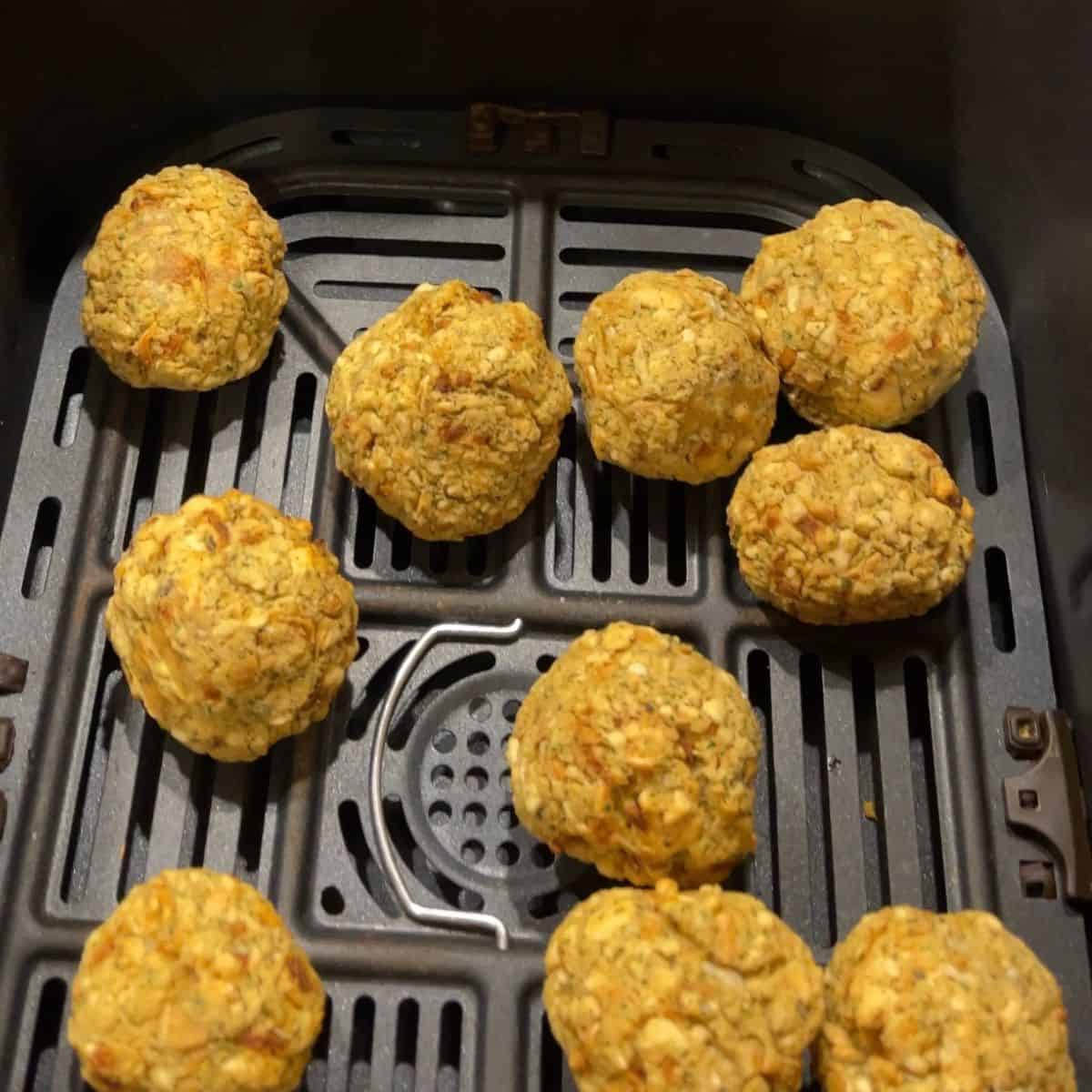Air fried Stuffing Balls inside the drawer of an Instant Vortex