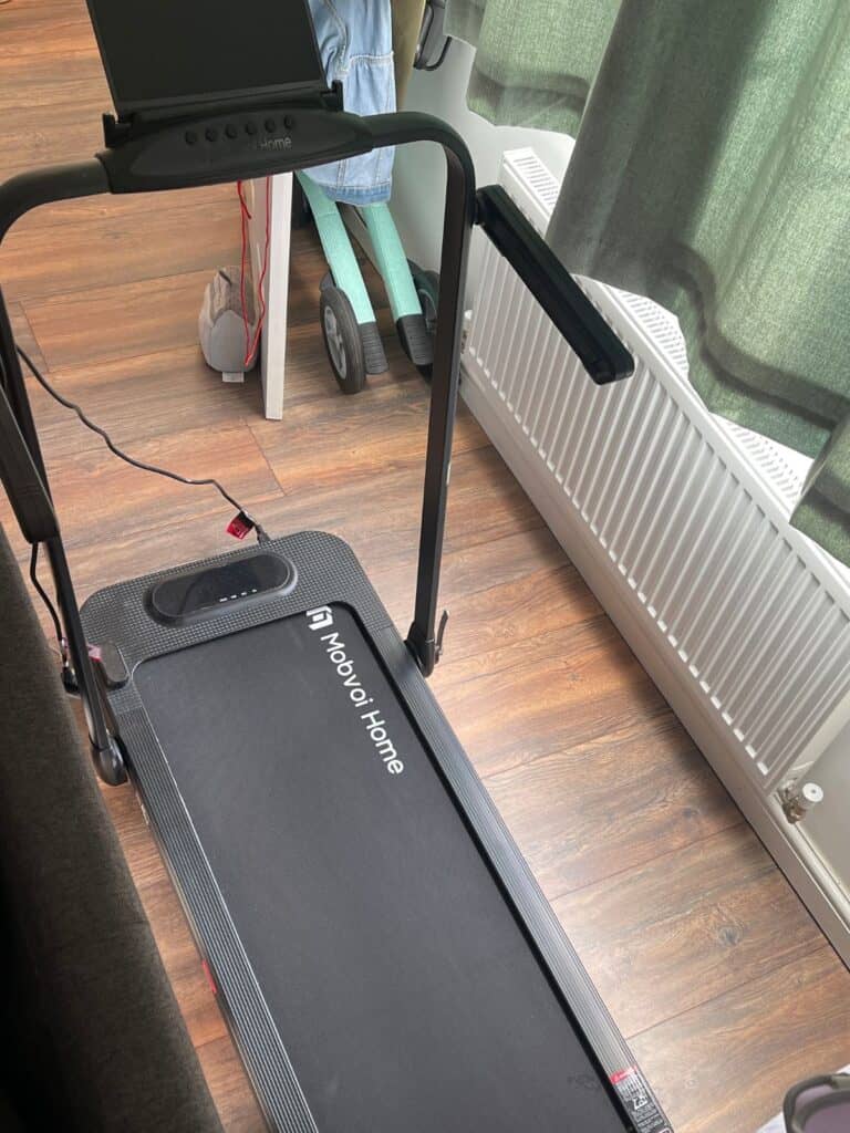 Image description: the Mobvoi Home Treadmill SE Incline Walking pad with a By Acre Nordic Pioneer in Glacier Green in the background
