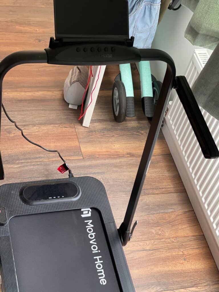 Image description: the Mobvoi Home Treadmill SE Incline Walking pad with a By Acre Nordic Pioneer in Glacier Green in the background